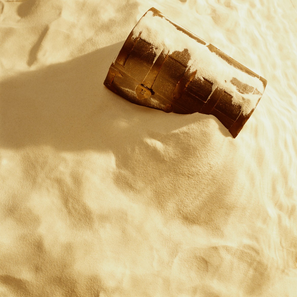 treasure chest buried in sand