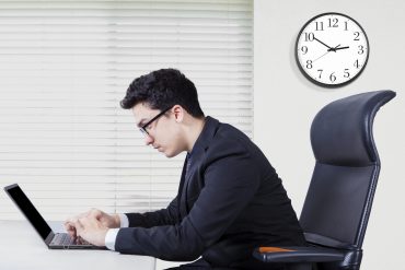 Portrait of middle eastern businessman typing on the laptop and looks concentration, shot in the office