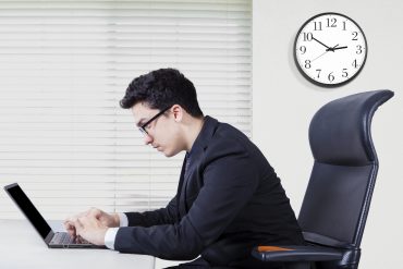 Portrait of middle eastern businessman typing on the laptop and looks concentration, shot in the office